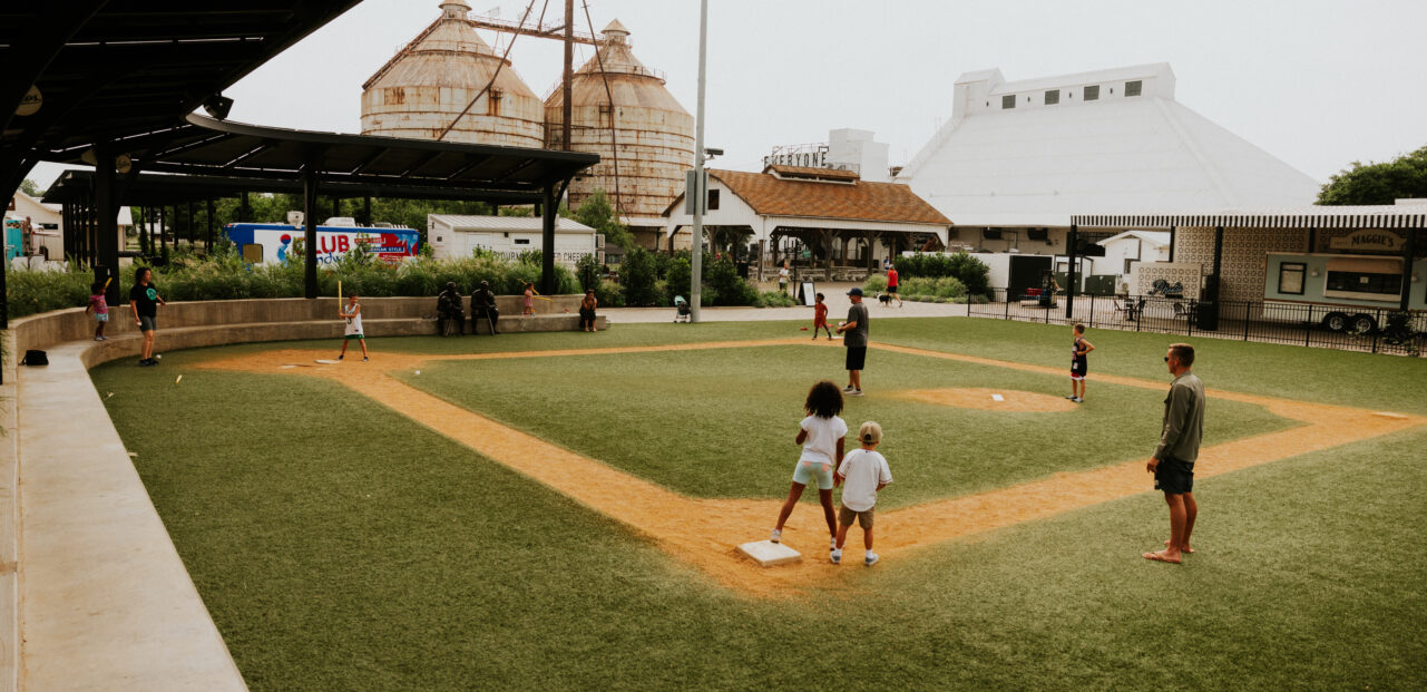 kids playing on baseball field